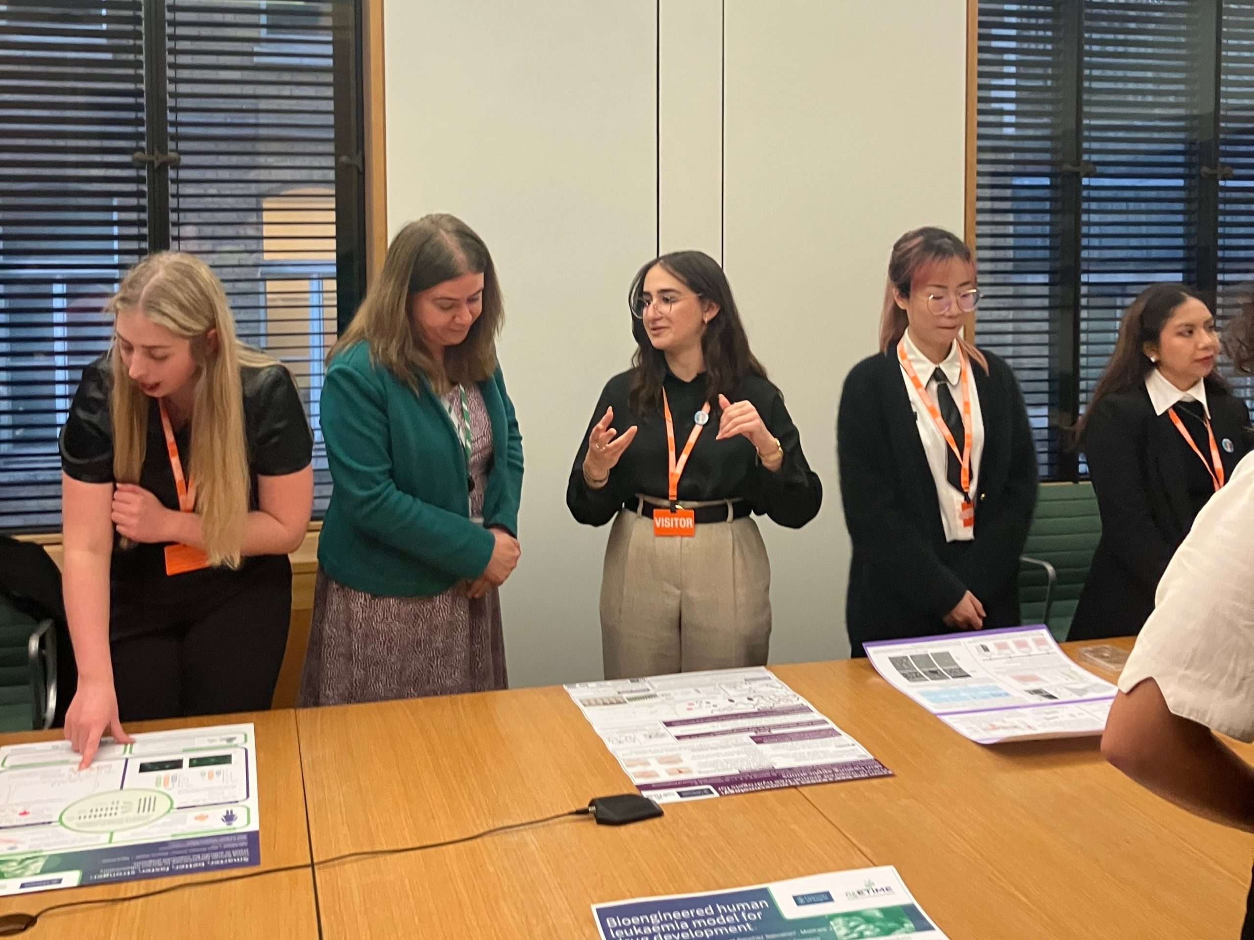 Alex Mayer MP talking with students